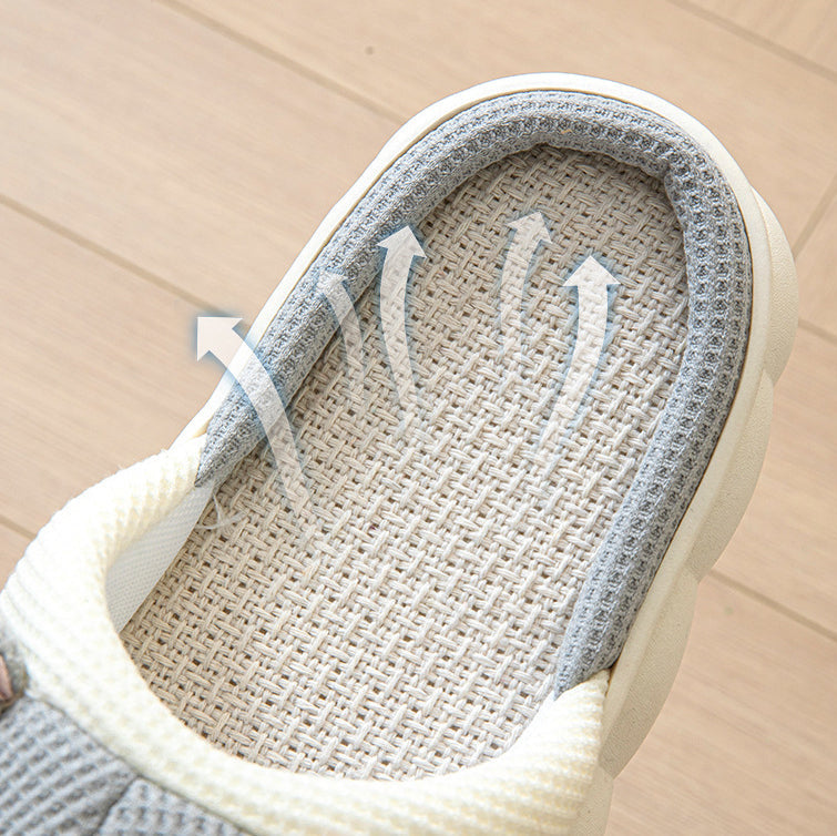 Close-up of a kawaii sandal with textured sole and white rim on a beige background