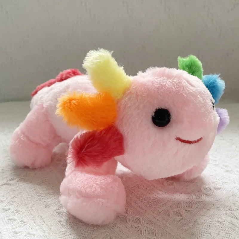 Pink kawaii plush toy with colorful pom-pom ears on a light background