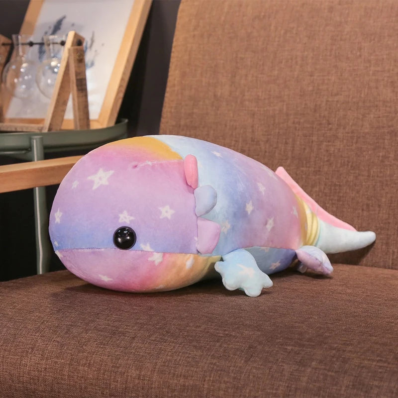 Colorful kawaii plush toy whale on a brown surface with a blurred background