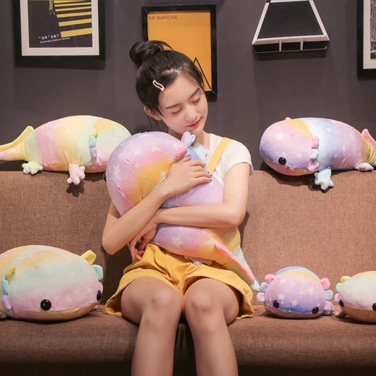 Young girl holding a kawaii plush toy surrounded by similar plush toys on a couch.