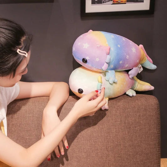 Person interacting with a colorful kawaii plush toy on a couch