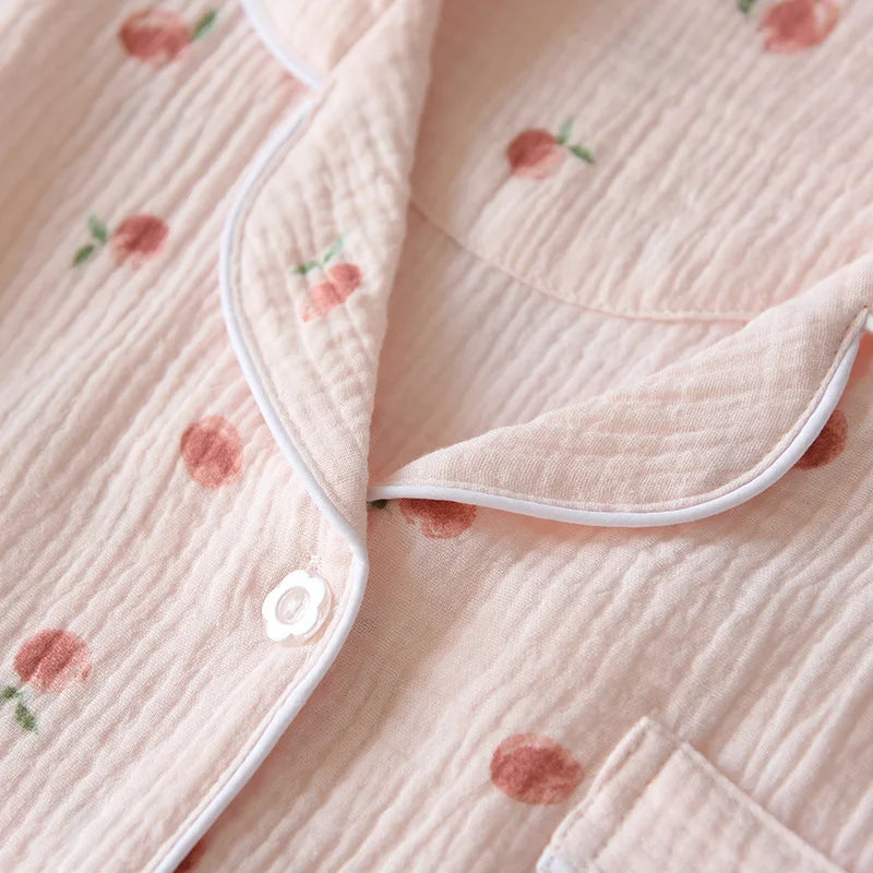 Close-up of a soft fabric with kawaii floral patterns and a button detail.
