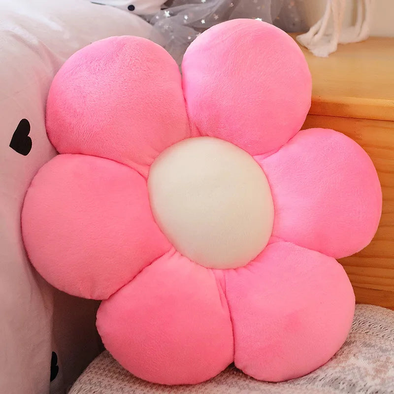 Pink flower-shaped Kawaii cushion on a soft surface