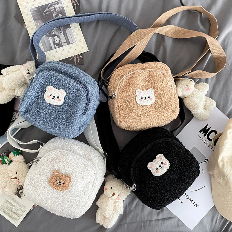 Four small bags with Kawaii teddy bear designs on a surface with teddy bears around