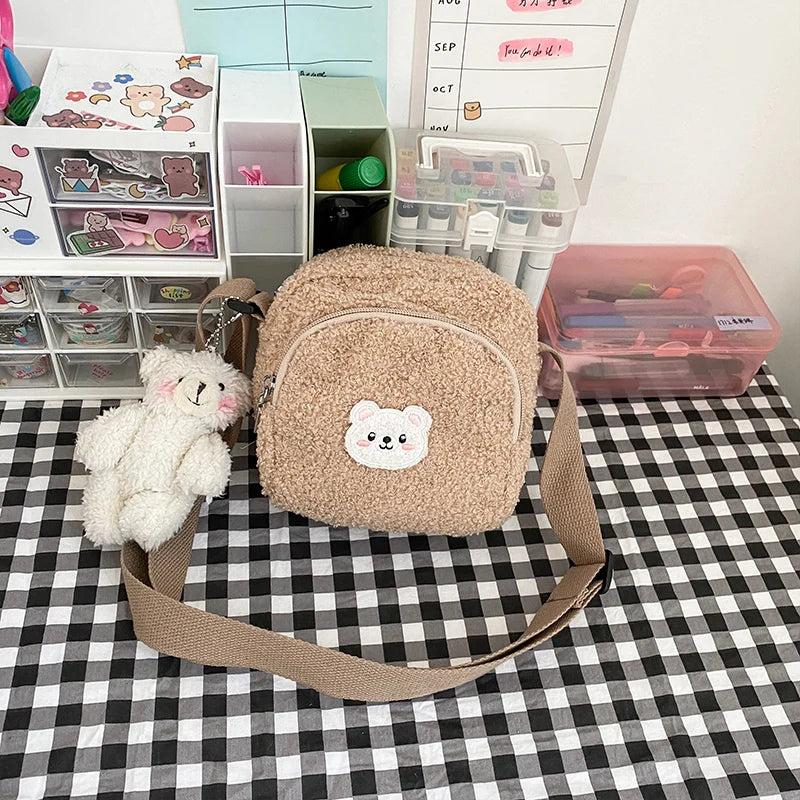 Beige plush backpack with Kawaii bear emblem on a checkered tablecloth, surrounded by storage bins.
