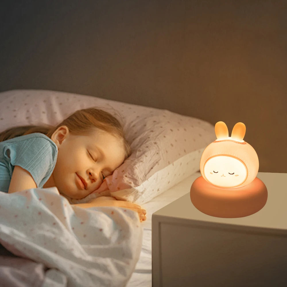 Child sleeping in bed with a kawaii night light on a nightstand