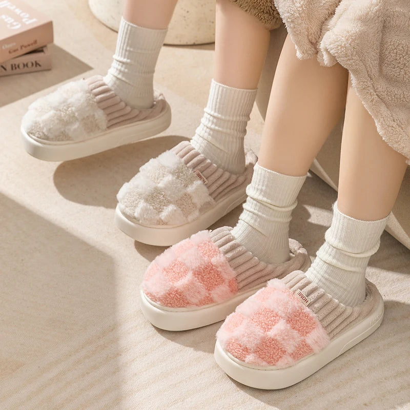 Children's feet wearing fluffy kawaii slippers with pink interior on a light wooden floor.