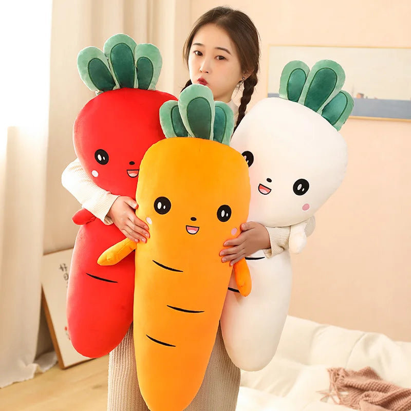 Person holding three kawaii plush toys shaped like a carrot, radish, and another vegetable.