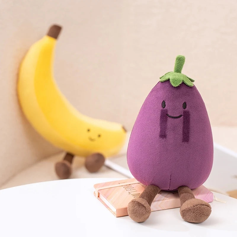 Kawaii plush toy shaped like an eggplant with a banana in the background