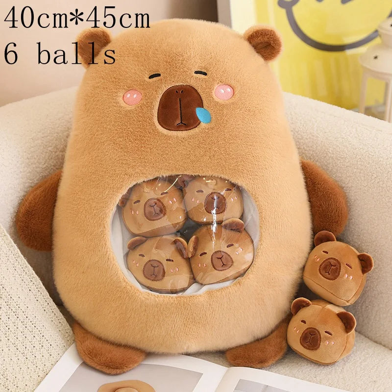 Kawaii plush bear toy with small bear figures inside, sitting on a couch.