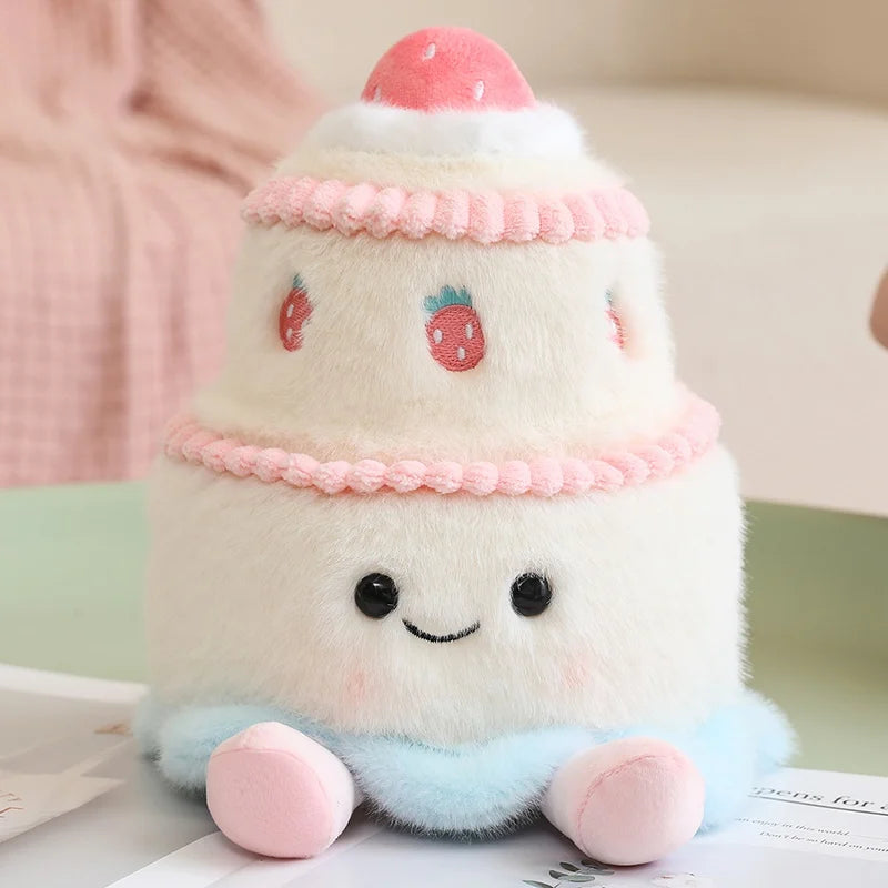 Plush toy resembling a cake with kawaii strawberry decorations on a light background