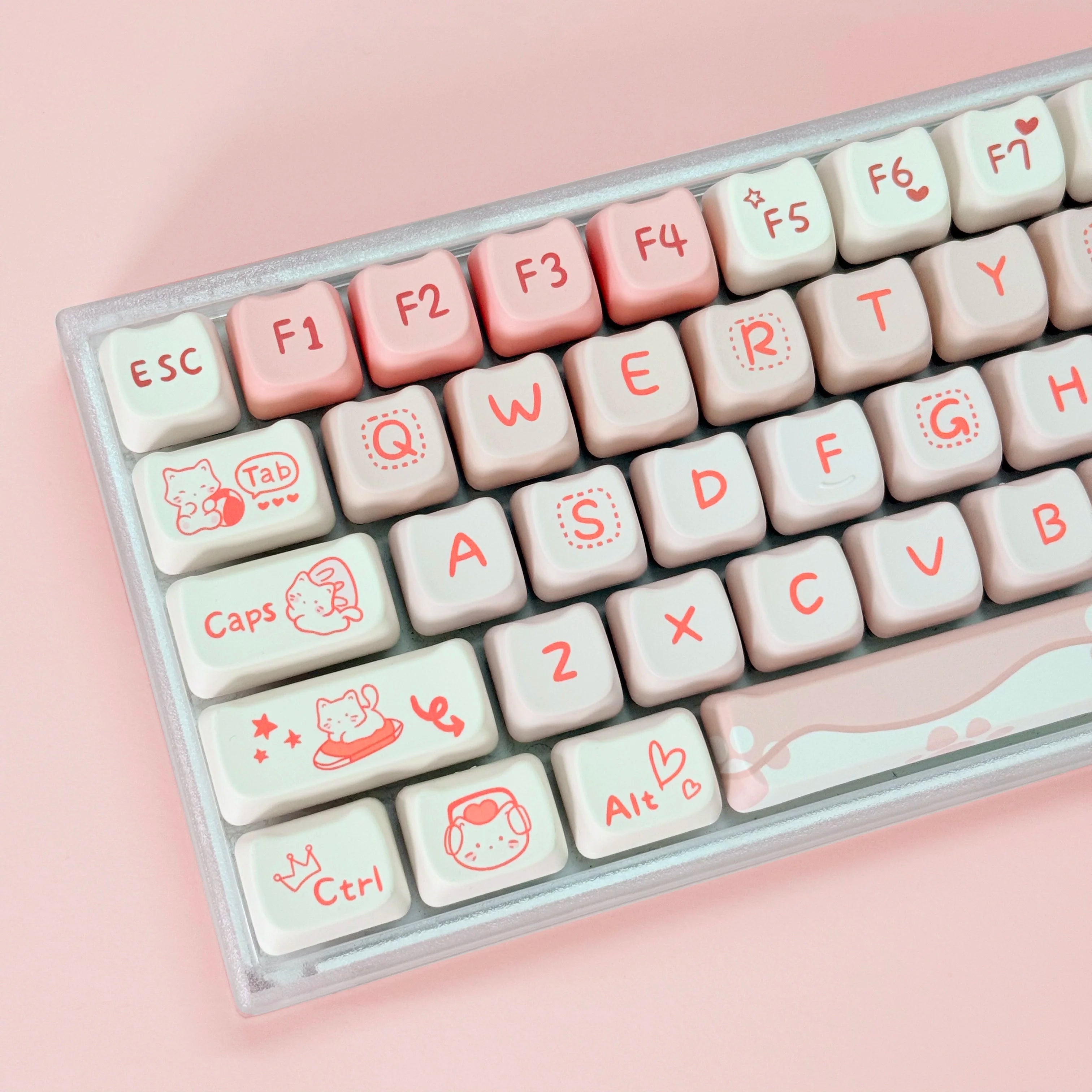 Keyboard with decorative Kawaii keycaps on a pink background