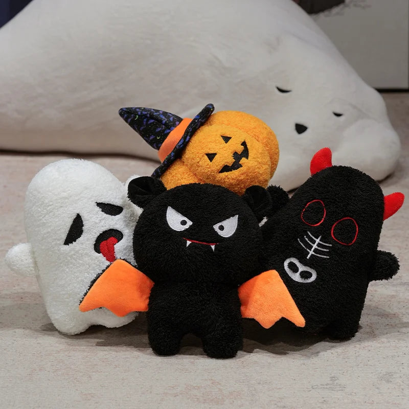 Halloween-themed plush kawaii toys including a ghost, jack-o'-lantern, and black cat on a neutral background.