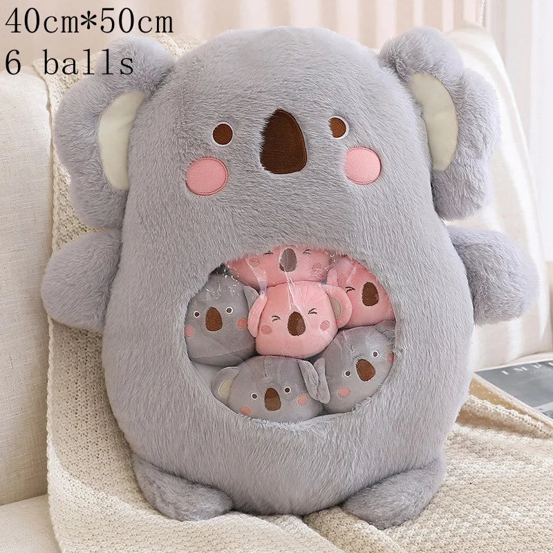 Kawaii plush toy shaped like a koala with small koala plushies inside, on a light-colored surface.