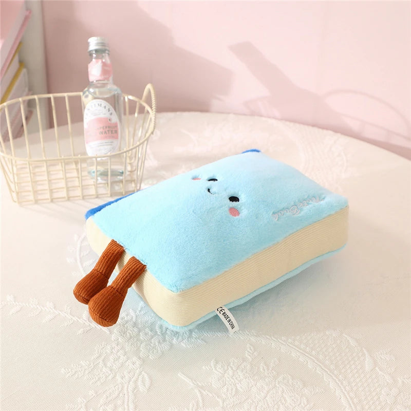 Cute kawaii plush toy resembling a book with animal legs on a bed