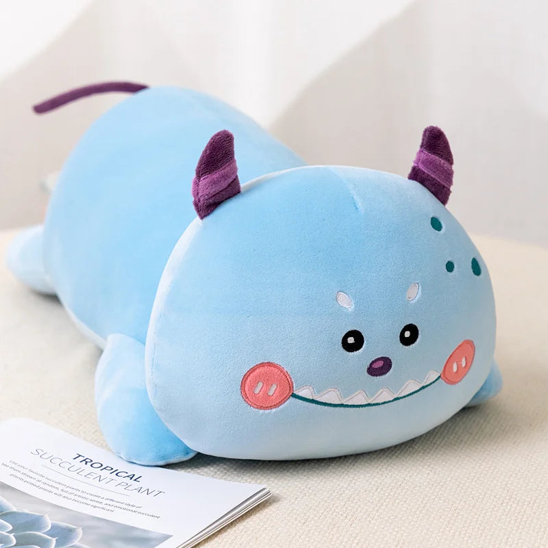 Cute blue kawaii plush toy with purple horns on a light surface