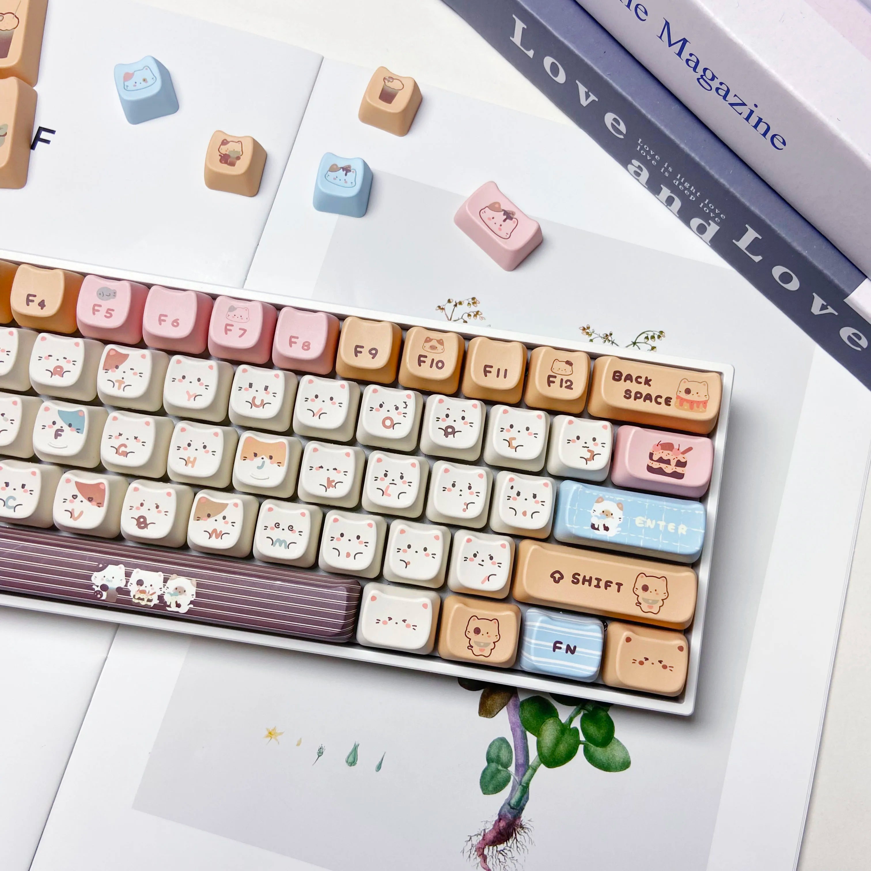 Keyboard with Kawaii keycaps on a white surface