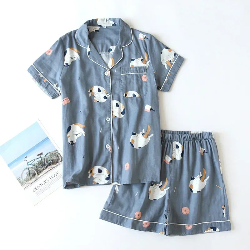Blue pajama set with kawaii dog pattern on a white background