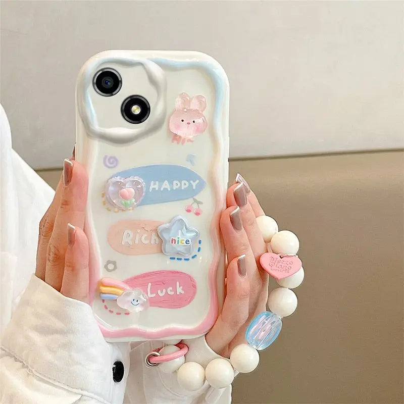 Phone case with kawaii designs and text held by a person