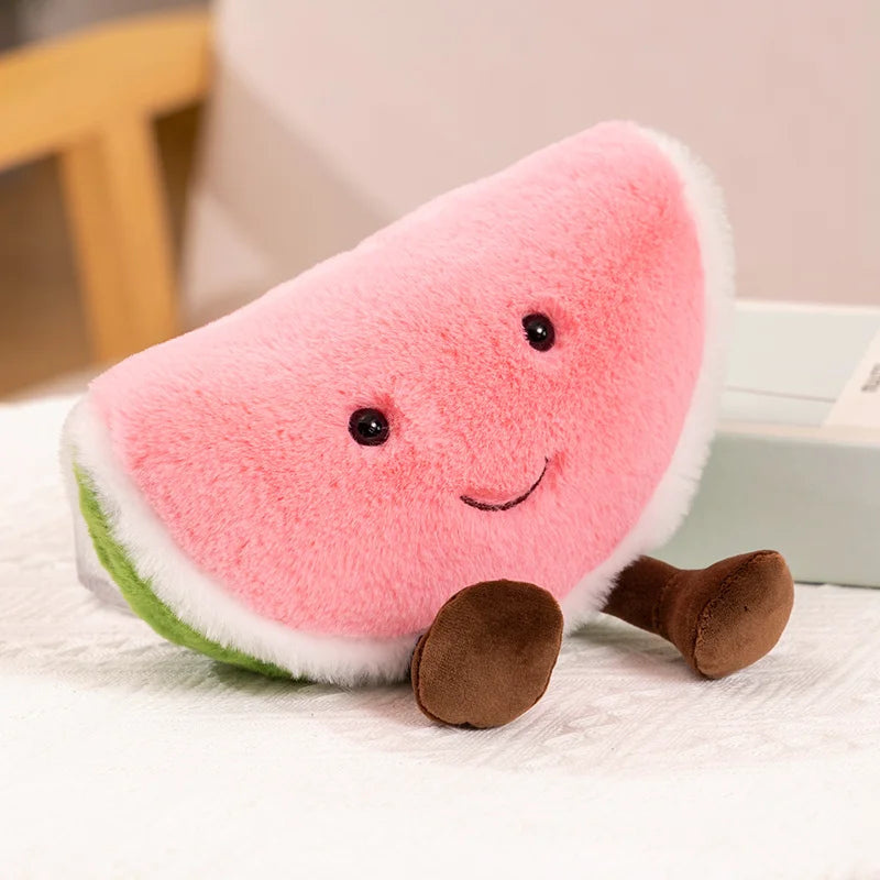 Plush kawaii toy shaped like a watermelon slice with a smiling face on a light surface.