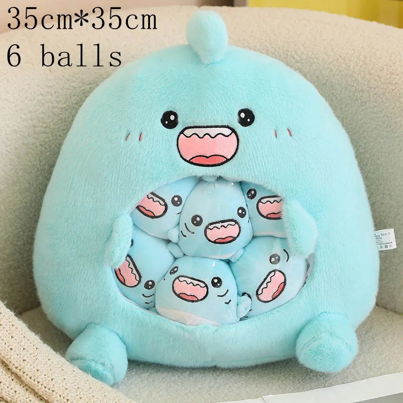 Light blue kawaii plush toy with cartoon face and six smaller plush balls inside, on a beige surface.