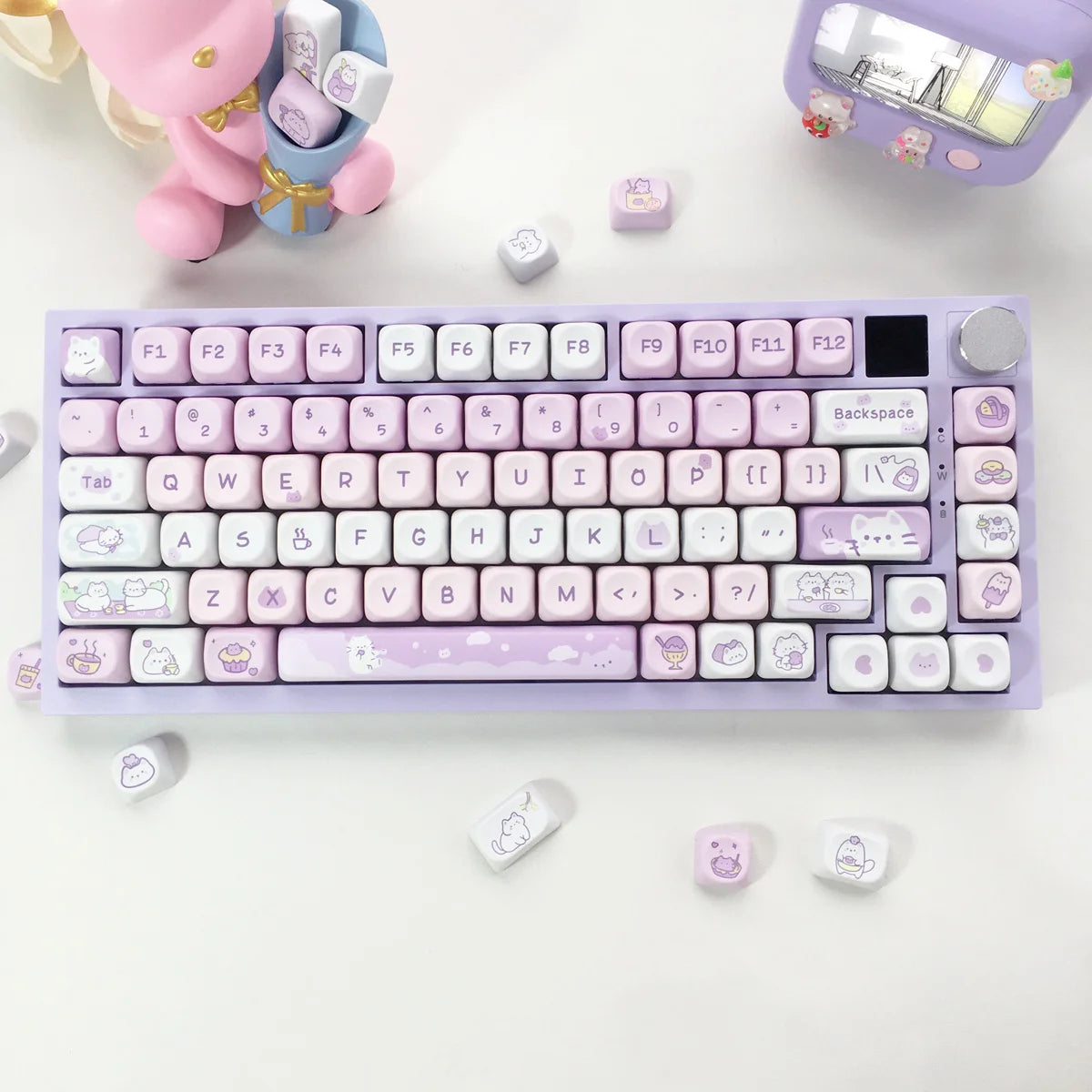 Pastel-colored keyboard with Kawaii decorative keys on a white surface