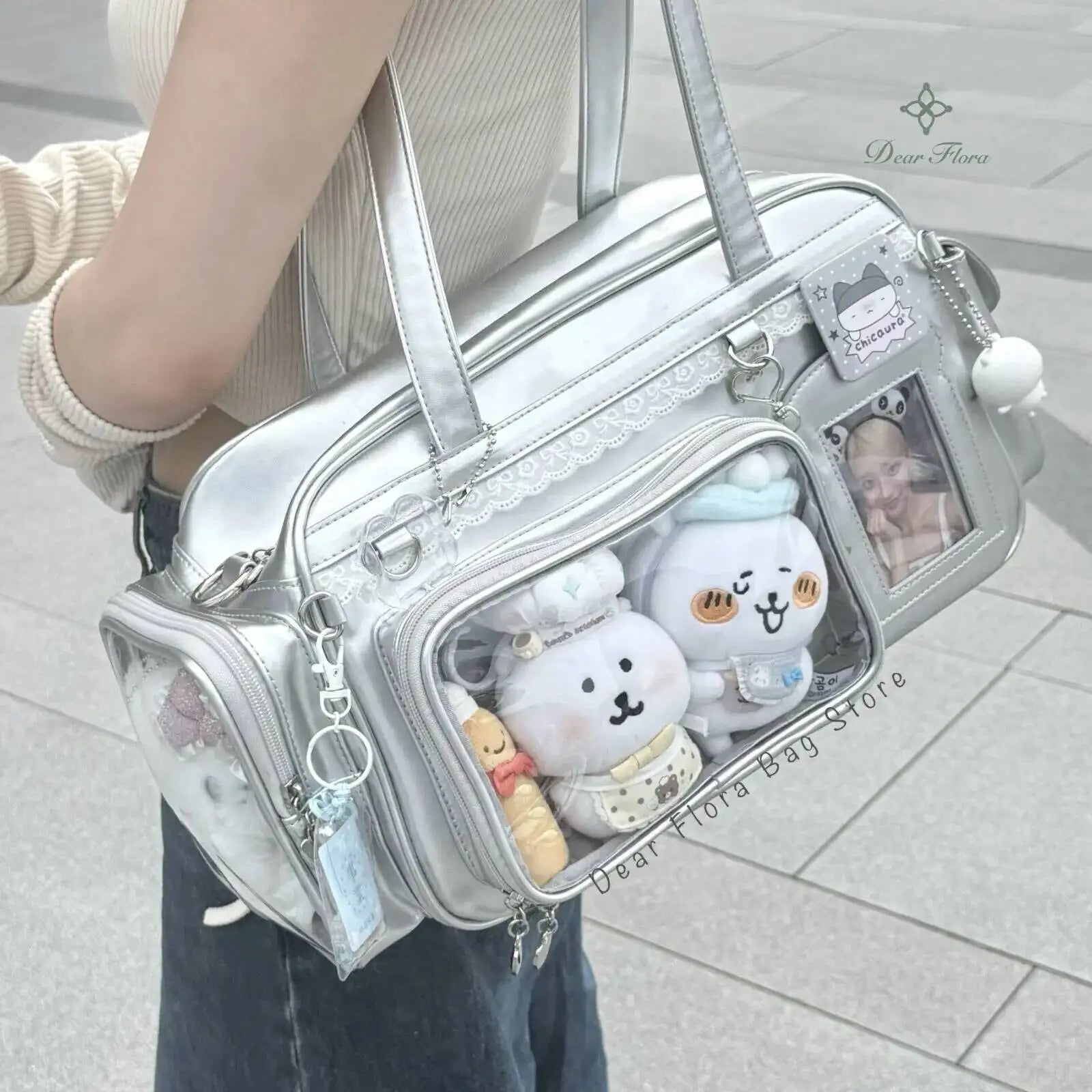Silver Kawaii handbag with plush toys and decorative elements on a light background