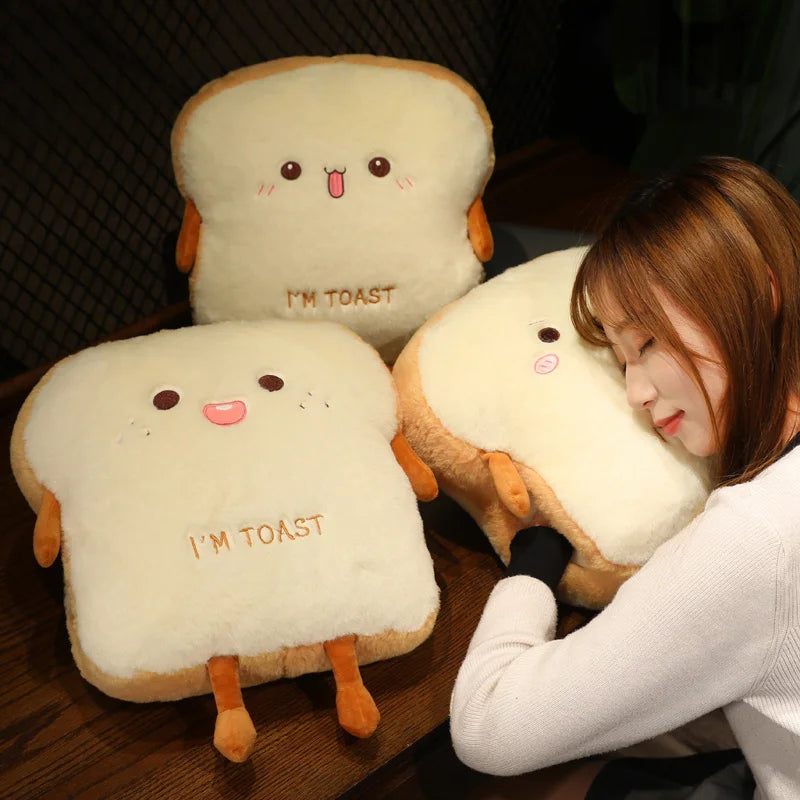 Two cute toast-shaped kawaii cushions with a person lying on one of them.