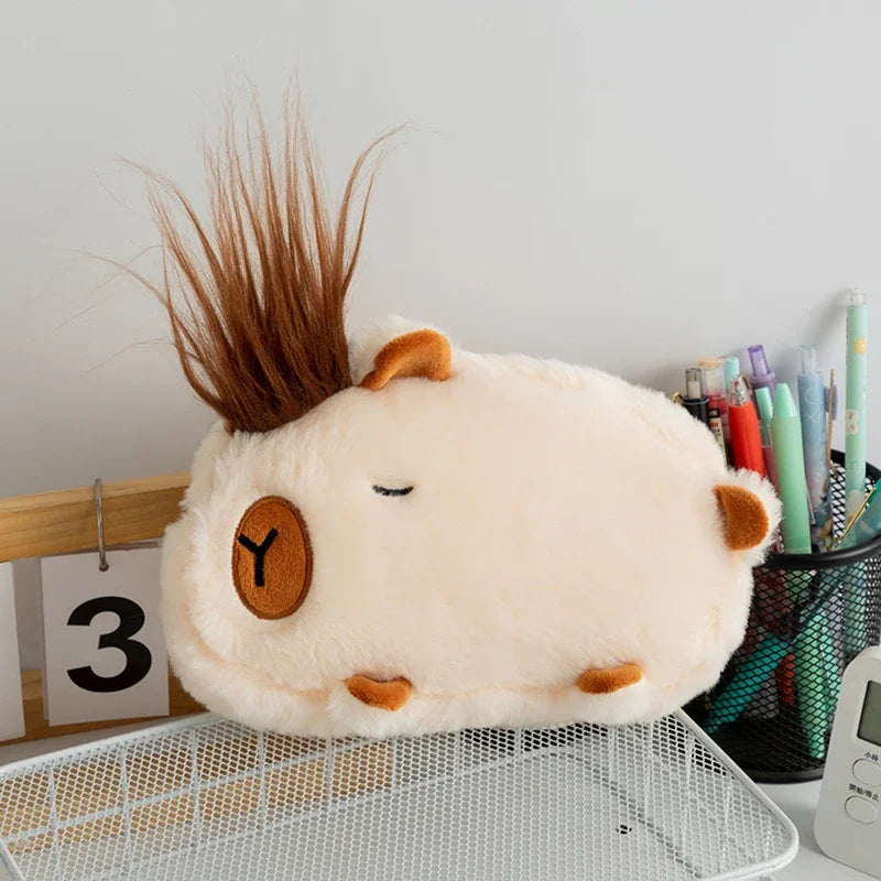 Plush toy resembling a kawaii cartoon character with spiky hair on a desk.