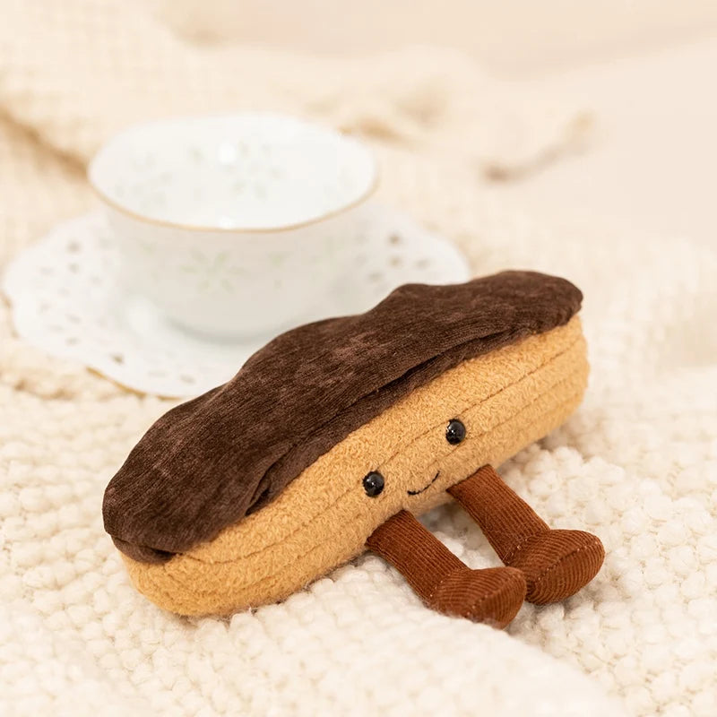 Plush kawaii toy resembling a bagel with a smiling face on a textured surface.