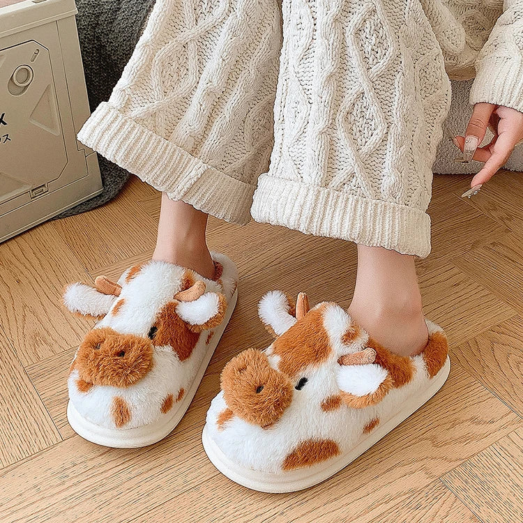 Person wearing kawaii cow-themed slippers on a wooden floor