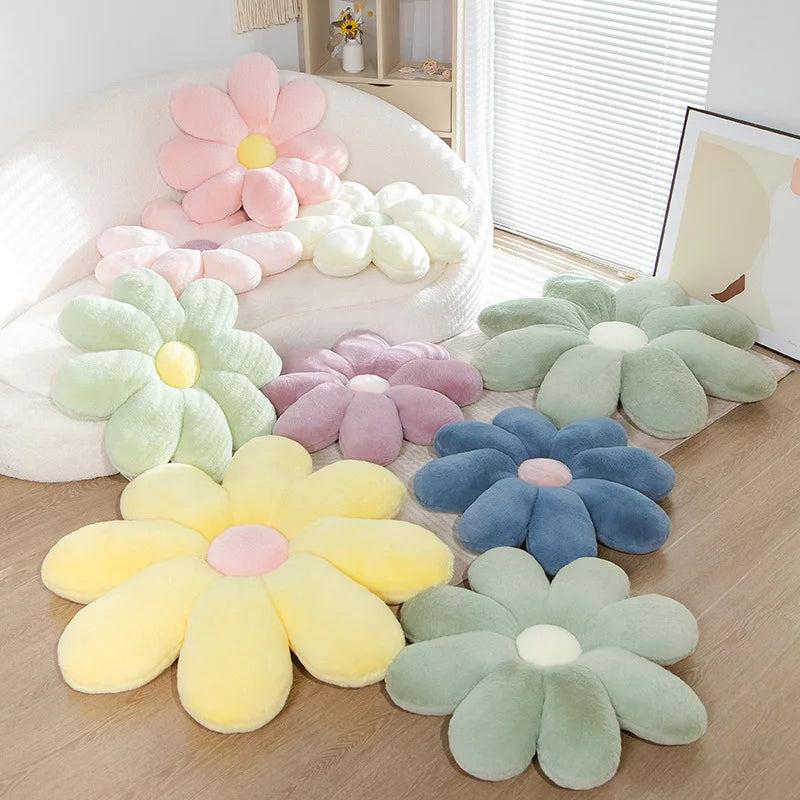 Set of colorful flower-shaped Kawaii cushions on a wooden floor.