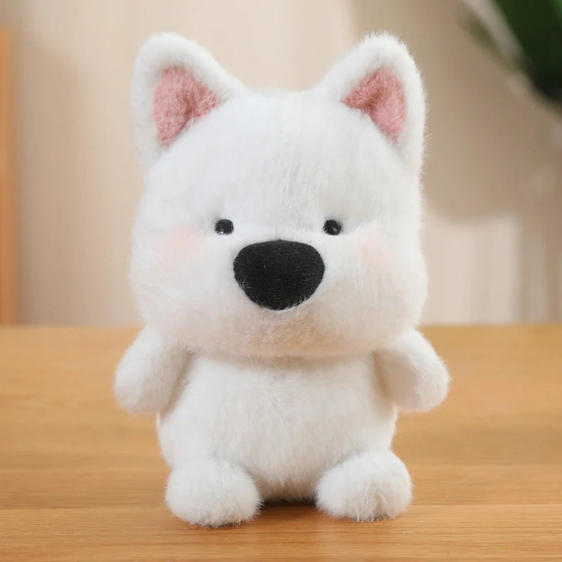 White plush dog kawaii toy with pink ears on a wooden surface