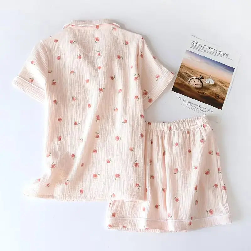 Pink children's outfit with a subtle kawaii pattern on a white background