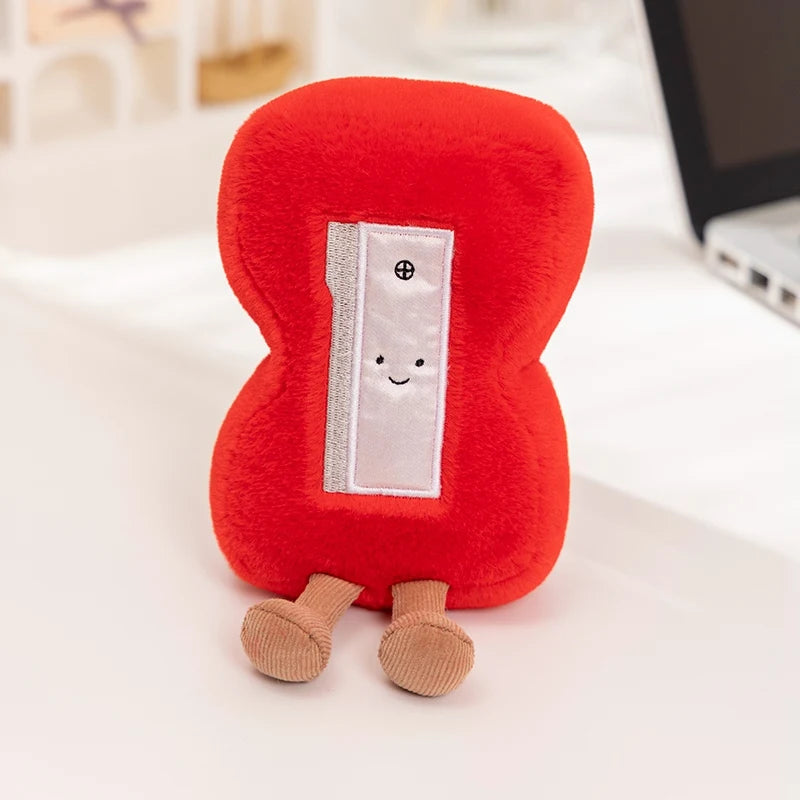 Red kawaii plush toy resembling a blood cell on a white surface