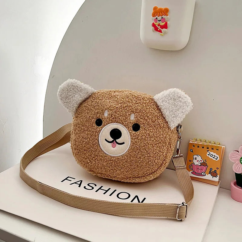 Kawaii brown teddy bear-shaped bag with a strap on a white surface
