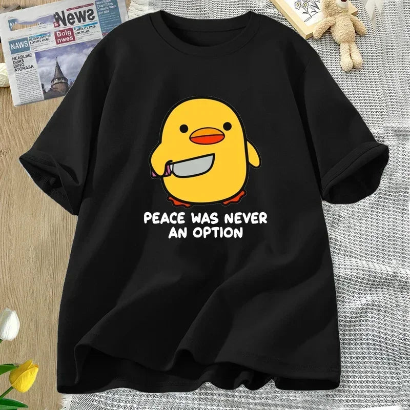 Black t-shirt with a yellow kawaii duck graphic and 'Peace was never an option' text on a textured surface.
