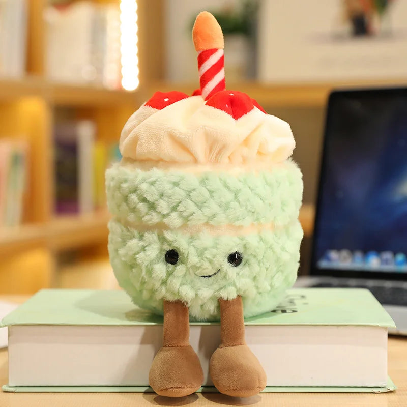 Plush kawaii toy resembling a birthday cake with a candle on a book
