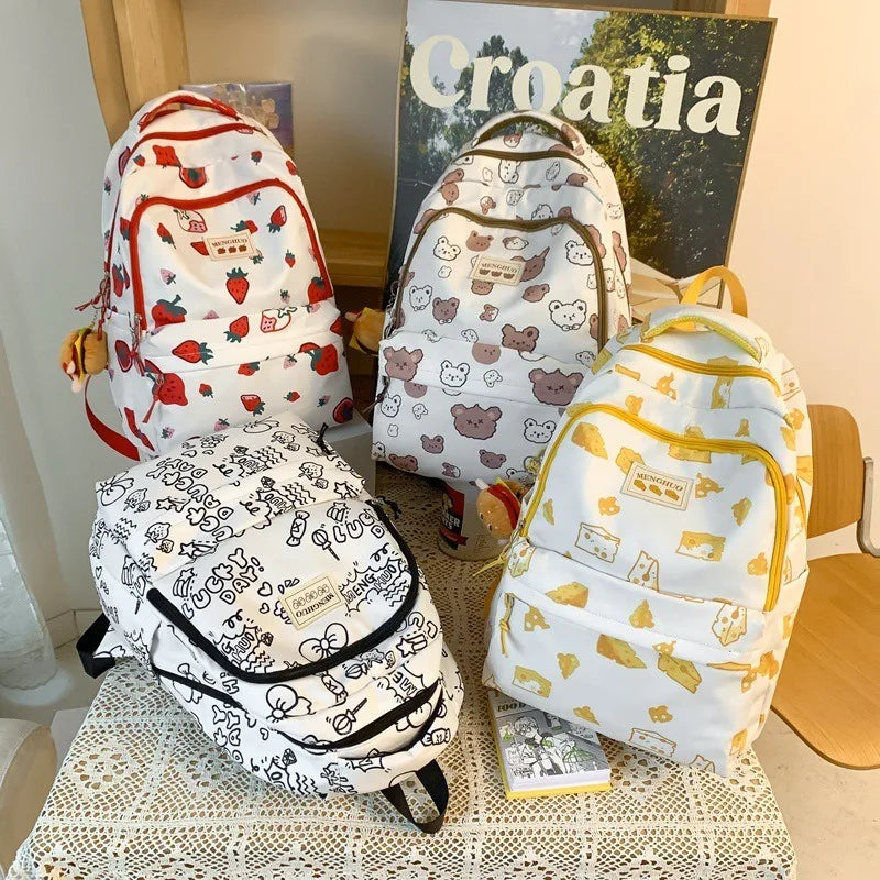 Four patterned Kawaii backpacks on a lace tablecloth with a 'Croatia' sign in the background.