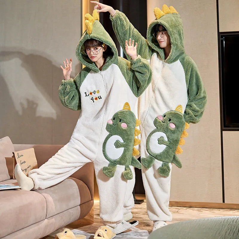 Two people wearing green kawaii dinosaur-themed onesies in a living room.