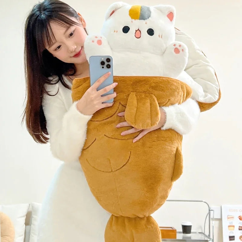Person holding a large, plush, kawaii cat-shaped pillow with a white background
