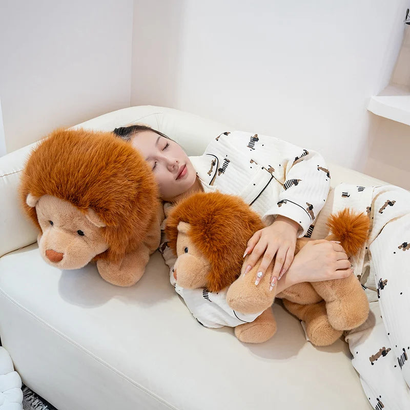 Person lying on a couch with two lion kawaii plush toys