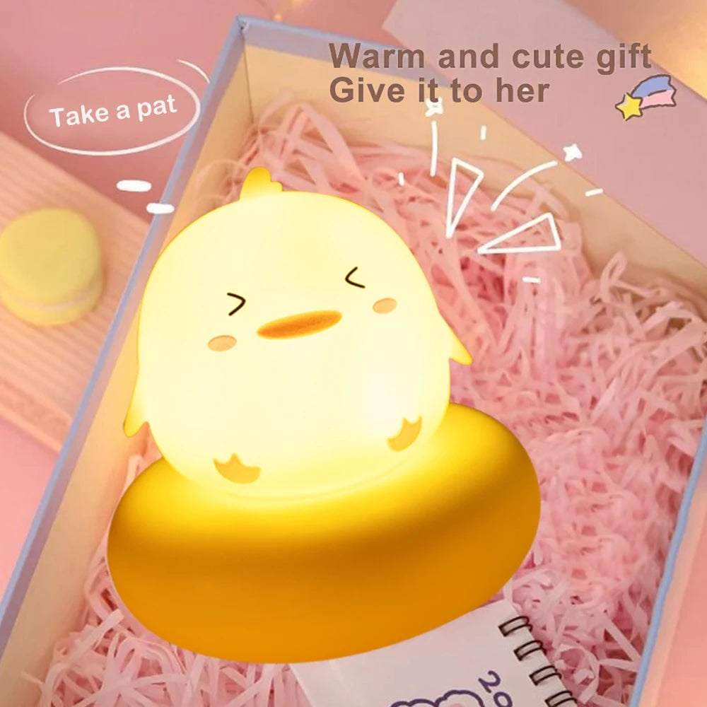 Cute yellow kawaii chick-shaped night light in a gift box with pink interior
