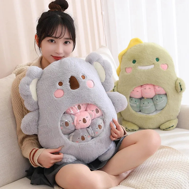 Person holding a large gray kawaii plush toy with multiple faces, sitting on a couch.