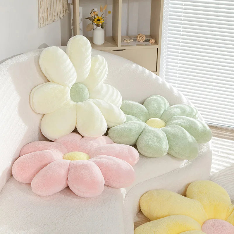 Flower-shaped Kawaii cushions in pastel colors on a chair.