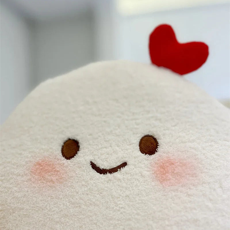 Plush toy with a kawaii smiling face and red heart on a blurred background