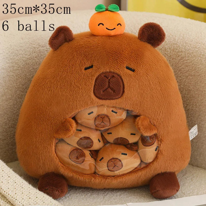 Plush bear toy with small kawaii plush pumpkins on a beige surface