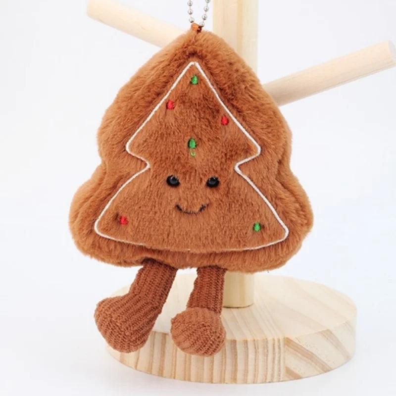 Plush toy shaped like a kawaii gingerbread man with a smiling face on a white background