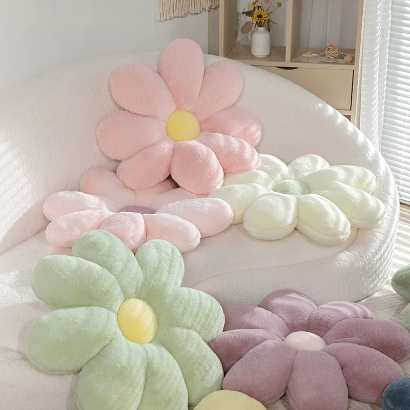 Kawaii flower-shaped cushions in pastel colors on a white chair.