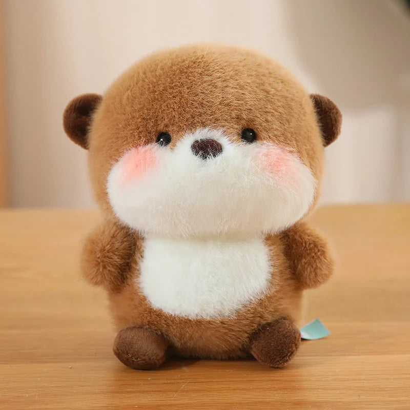 Cute plush kawaii toy otter on a wooden surface with a blurred background